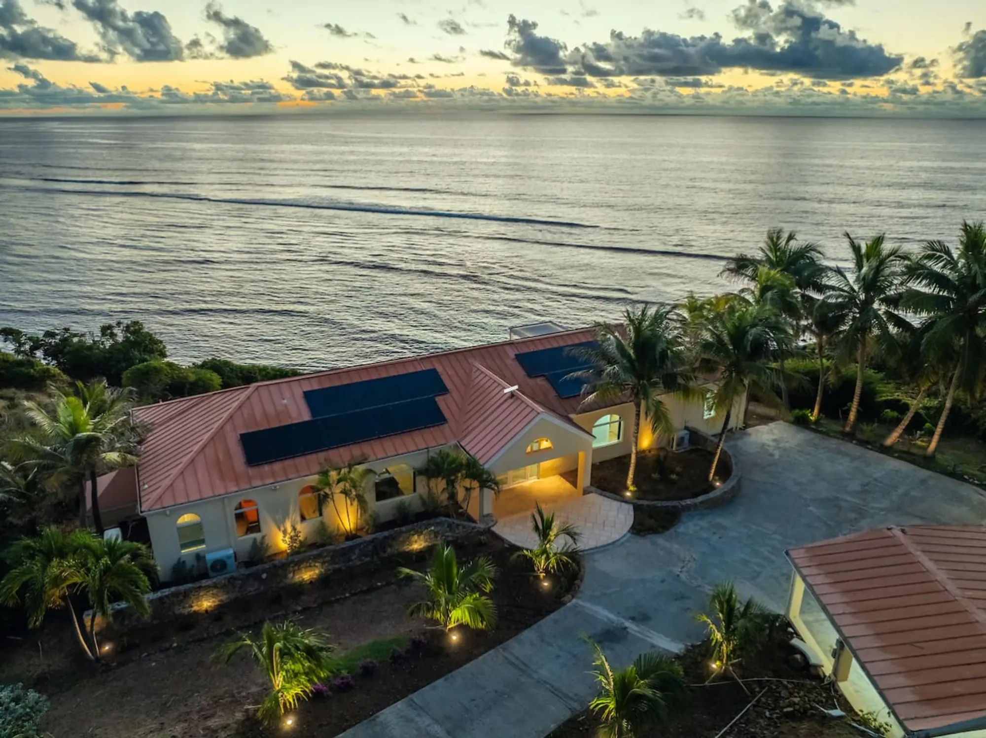 The villa and the East End coast at dusk