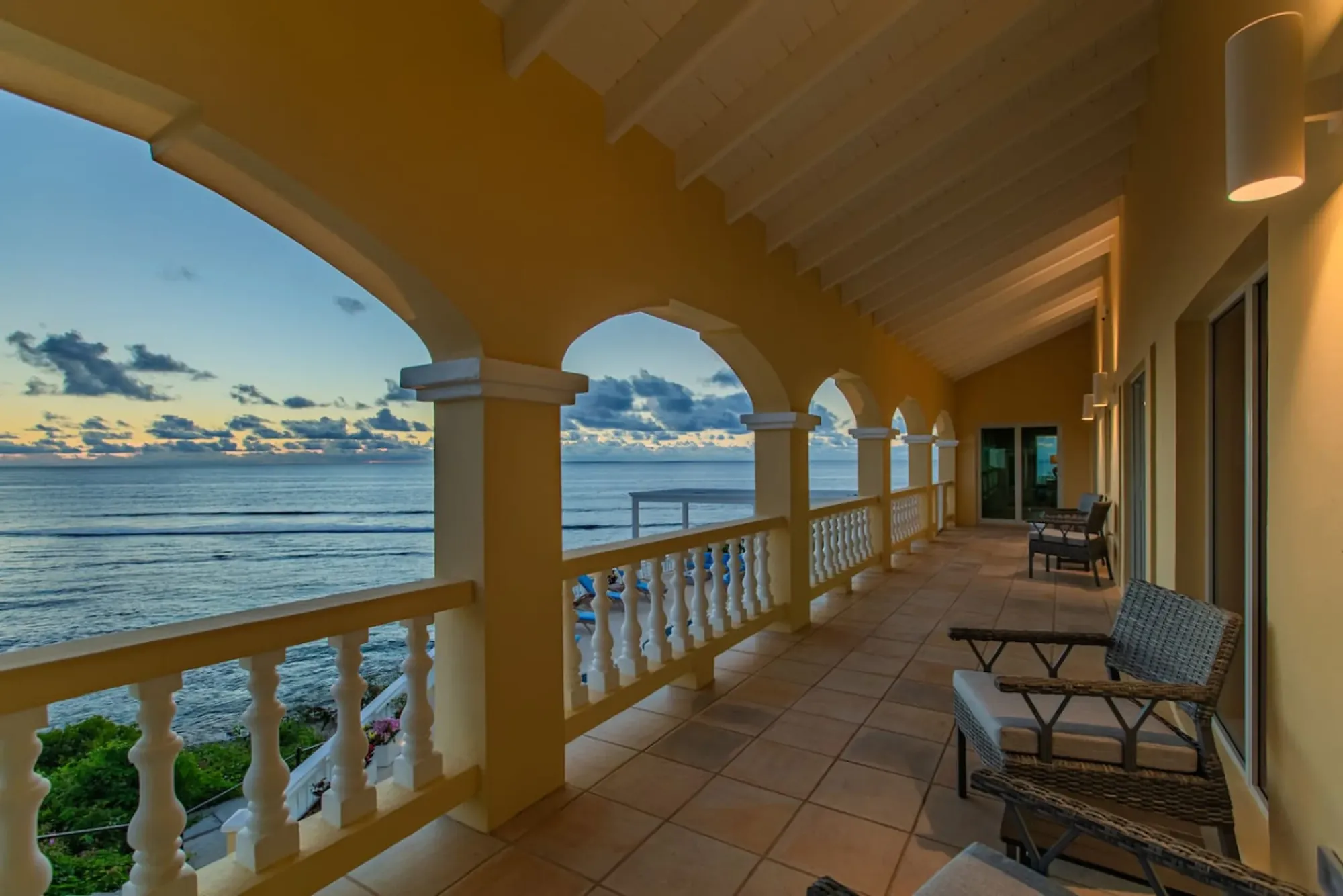 Sunrise light along the arched veranda