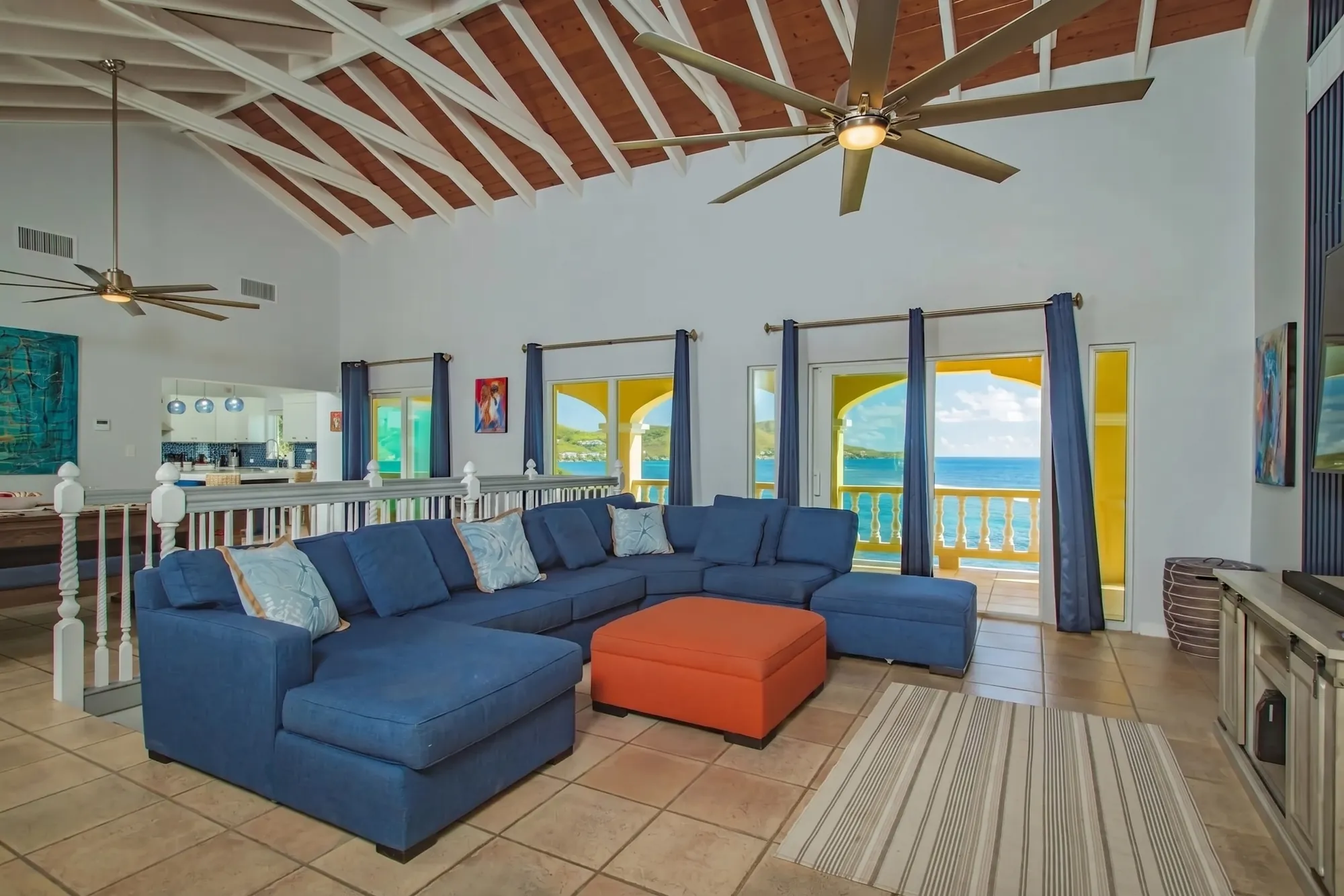 The great room with a vaulted wood-beam ceiling