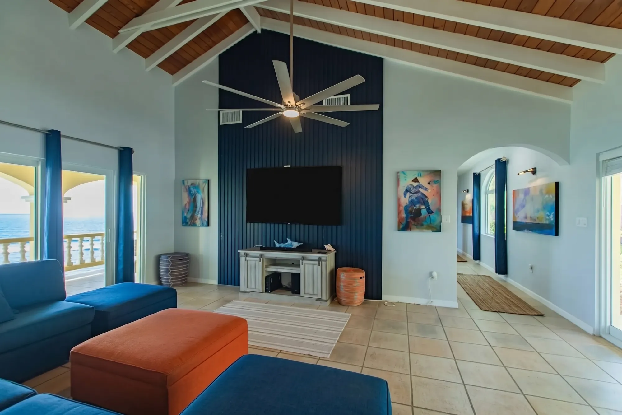 Open living area with sectional seating and ocean views