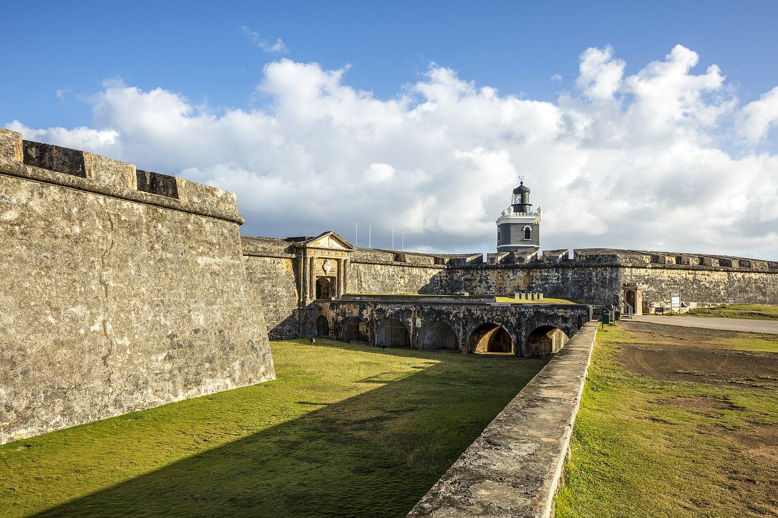 The lawn, walls and lighthouse of El Morro fortress in San Juan, Puerto Rico