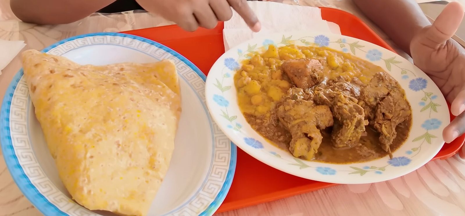 A plate of curry-chicken roti